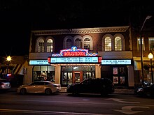 A nighttime photo of the exterior of the Grandin Theatre