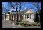 Architecturally the court are a fine example of the public building style at the turn of the century. The colonnaded front facade has two extending rooms and stoepkamers on either side. These extending facades have low triangular pediments with a rather a Somerset West became an assistant Magistracy under Stellenbosch in 1892 with Mr. J. St. Vincent Cripps as first assistant magistrate. In 1898 a courthouse building which also housed the post office was completed. Somerset West. by this time having become Architectural style: Edwardian. Type of site: Magistrates Office Previous use: Residence. Current use: Civic. This building was erected in 1898. It originally housed the post office, as well as the magistrate's court, after Somerset West was proclaimed an Assistant Magistracy in 1892.