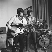 Muff Winwood (on left) playing bass guitar for the Spencer Davis Group in Amsterdam, 1966