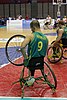 Tristan Knowles swaps a wheel mid-match during the 2010 World Wheelchair Basketball Championship.