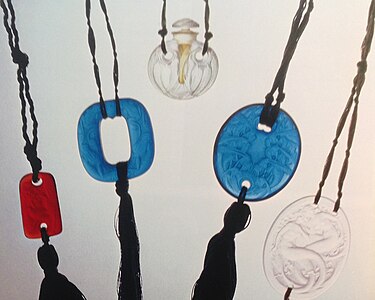 Molded glass pendants on silk cords by René Lalique (1925–1930)