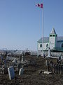 Tomb for "The Lost Patrol", Fort McPherson, Northwest Territories (right of the flagpole)