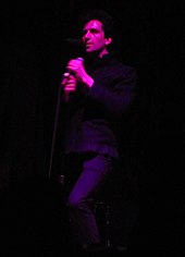 Francis Starlite performing on a dimmed stage with Francis and the Lights at Webster Hall in New York City on October 12, 2010