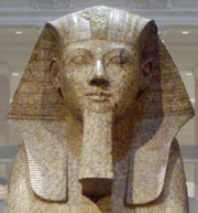 Large granite sphinx bearing the likeness of Hatshepsut, depicted with a false beard