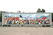 A mural in Pyongyang of a young Kim Il Sung giving a speech