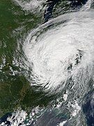 A satellite image of a tropical cyclone over the United States with cyclonically organized clouds