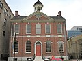 One example of a clock in a pediment; there are fairly many of these so I think they deserve mention in the text, as being excluded. Also mere Federal-style windows