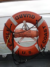 An orange lifebuoy on the US Coast Guard ship Eagle.