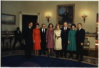 The incoming and outgoing first and second couples pose for a photograph at the White House on the day of the inauguration of Jimmy Carter. L-R: Vice President-elect Walter Mondale, incoming second lady Joan Mondale, outgoing Vice President Nelson Rockefeller, outgoing second lady Happy Rockefeller, Betty Ford, Gerald Ford, incoming first lady Rosalynn Carter, and President-elect Carter