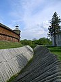 Defensive moat with fortified slopes