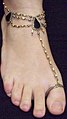 A toe ring with attached anklet.
