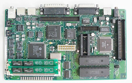 The main circuit board from an Apple Macintosh Classic II showing the CPU, memory and other logic chips.