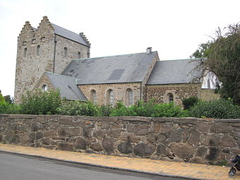 At Aa Church, Bornholm, Denmark, the western tower has a fortified appearance and crow-step gables.