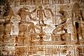 The god Khnum, accompanied by Heqet, moulds Ihy in a relief from the mammisi (birth temple) at Dendera Temple complex