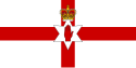 A red cross on a white field defaced with the Red Hand of Ulster, crowned on a six pointed white star.