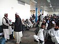 Men wearing perahan tunban, a form of shalwar kameez at Kabul Airport in Afghanistan