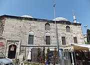 The mekteb (primary school), attached to the corner of the Evvel Madrasa near the east end of the complex