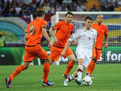 Players from the Netherlands national football team (wearing orange) vs. Denmark, Euro 2012