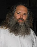 A white man with a long, grey beard