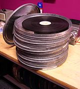 A 35 mm release print in the form that it would typically be delivered to a theatre in Europe. Each can contains roughly 2,000 feet of film, or 20 minutes of running time at 24 fps.