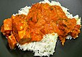 Image 48Chicken tikka masala, served atop rice. An Anglo-Indian meal, it is among the UK's most popular dishes. (from Culture of the United Kingdom)
