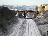 Leeds to Bradford Railway Line looking west towards Bradford. The bridge is Planetrees Road and the sidings on the left are for the scrapyard.