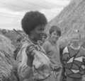 Ndeutala Hishongwa, a Namibian writer and activist, at CERES in 1988 in front of African huts.