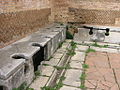 Image 48Public toilets (latrinae) from Ostia Antica (from Roman Empire)