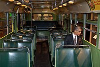 U.S. President Barack Obama sitting on the bus. Parks was arrested sitting in the same row Obama is in, but on the opposite side.