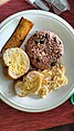 Costa Rican breakfast— gallo pinto served with plantain, egg and bread.