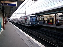 A train (MI2N) arriving at the station (towards Paris)