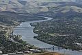A telephoto view of the Snake River dividing Lewiston, Idaho and Clarkston, Washington. The photographer is atop Lewiston Hill, looking south. The Interstate Highway Bridge is the closer of the two bridges. The Southway Bridge is in the distance.