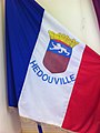 A flag with the coat of arms of Hédouville