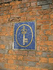 The Post Office Savings Bank logo in mosaic on the east wall of Blythe House