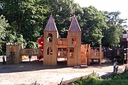 light brown wooden structure resembling a castle