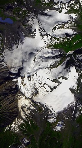 Overhead glimpse of a large snowfield in a mountainous environment.