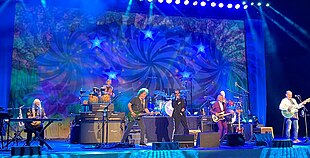 Ringo Starr & His All-Starr Band performing in 2022. (left to right) Edgar Winter, Warren Ham, Steve Lukather, Ringo Starr, Hamish Stuart, Gregg Bissonette and Colin Hay.