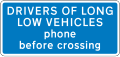 Information sign for large vehicles informing to phone at automatic level crossing