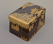 Inlaid maki-e raden writing Box with "Eight Bridges" ( yatsuhashi ) design, by Ogata Kōrin, National Treasure, Edo period, 18th century. The flowers are abalone shell inlays. Tokyo National Museum[10]