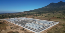 Aerial view of a prison near a volcano in an isolated area