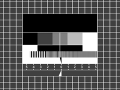 Recreation of the FuBK monochrome variant, omitting the centre circle and replacing the colour bars with a black box showing the transmitter name and channel, as well as an on-screen line gauge replacing the ±V/ +U Ramp and +V/ ±U Anti PAL sections near the bottom.