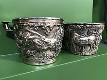 Two silver-coloured cups, in the style of the Mycenaean Vapheio Cups