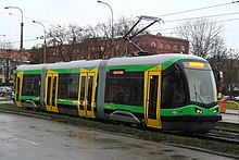 Three-section green and grey tram