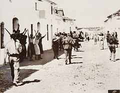 Constantina, women pleading with rebel troops for their men