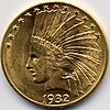 A gold coin with the date 1932, showing a woman wearing an Indian headdress and with thirteen stars