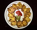 Bread pakora, made by deep-frying bread slices coated with gram flour