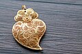 Image 13Typical Portuguese filigree heart shaped pendant, an iconic item in Portuguese fashion and design. (from Culture of Portugal)