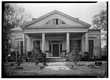 The front façade of Affleck's "Ingleside," from 1936. The house was built on two acres in the town of Washington, Adams County, Mississippi, by Affleck's wife, Anna M. Dunbar Smith, from 1839 to 1840. The Greek Revival-style house is built in the traditional Mississippi Cottage form. Affleck founded his famous Southern Nurseries at "Ingleside" and published his famous agricultural journals, newspaper articles, and plantation account books from the house. After the Affleck family left the area for Texas in 1860, the house was sold and had various owners until after the Civil War. In 1885, Allen Duckett Rawlings purchased the property as an investment. He died in 1887. The house and small acreage remained in the Rawlings family until 2018. The images is from the Historic American Buildings Survey, by James Butters, Photographer, April 15, 1936, entitled "FRONT MAIN ENTRANCE (SOUTH ELEVATION) - Rawlings House, Washington, Adams County, MS."