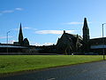 The setting of the Grannie Stone with F. T. Pilkington's 1863 Trinity church to the left and the former Wilson Fullarton Free church to the right[13]