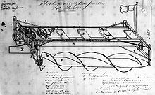 L'image représente un châssis de véhicule décrit comme un moyen de propulsion des barges par des vis sans fin. Le brevet a été déposé et délivré en 1874.